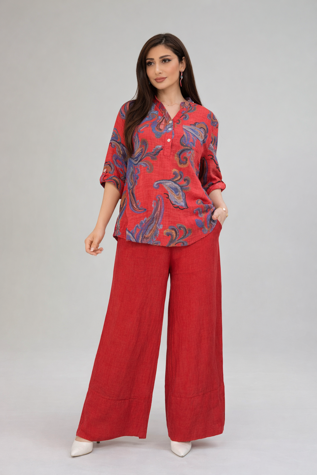 Model in red linen paisley set — confident studio look